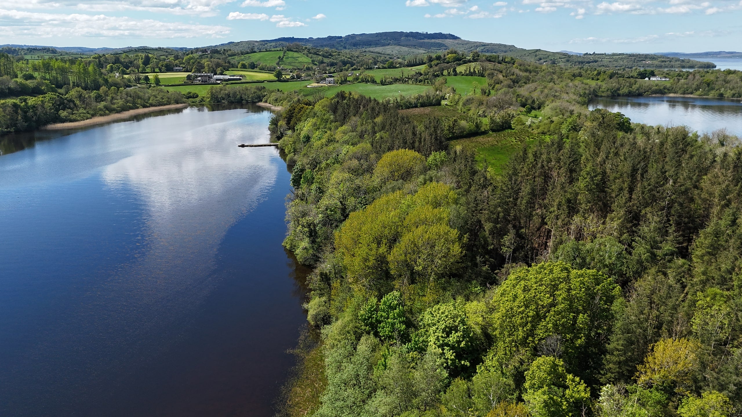 Aerial view across the shoreline and Lower Lough Erne