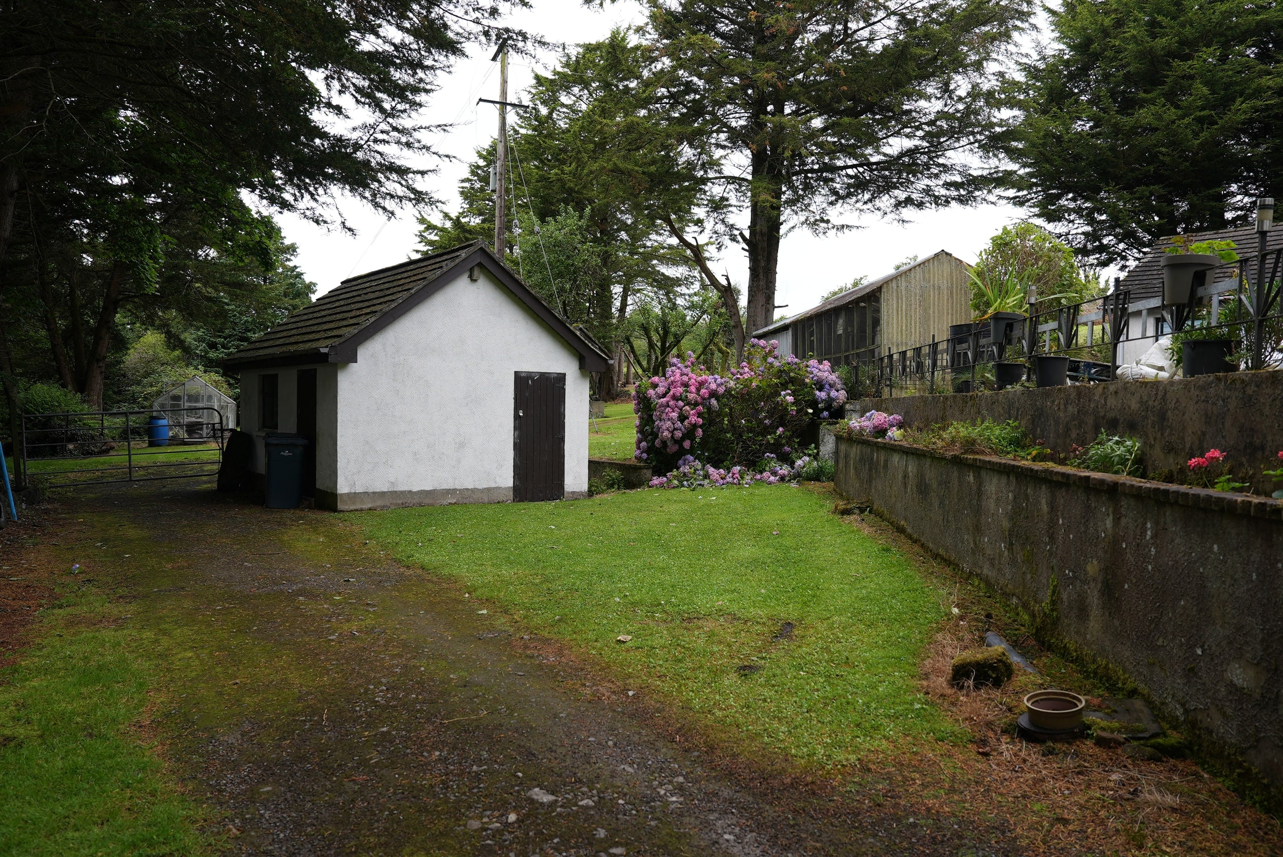 White detached byre beside the lane and main residence